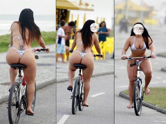 Esposa pedalando na praia